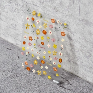 Detailed macro view of 5D embossed crayon flower nail stickers with 3D floral textures