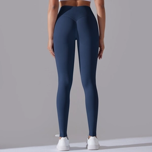 Detail view of seamless high-waisted navy yoga pants with compression ribbed waistband