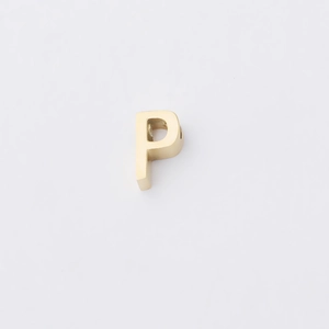 Close-up of polished gold mirror-finish stainless steel letter P alphabet bead charm