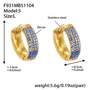 Detail of 18k gold plated hoop earrings with blue gradient cubic zirconia pave setting