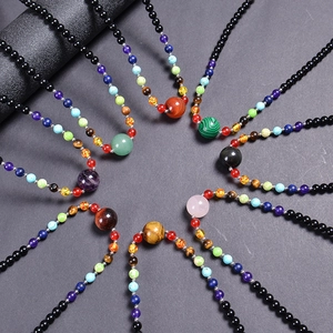 7 Chakra stone yoga necklaces with 6mm pink quartz and tiger eye pendants in radial layout