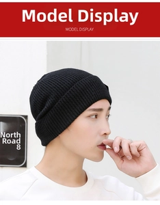 Side view of male model wearing a black ribbed knit beanie with sequin details