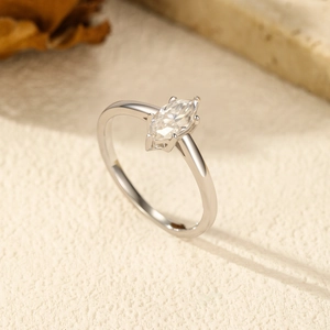Elegant S925 sterling silver marquise cut moissanite ring on a natural textured background