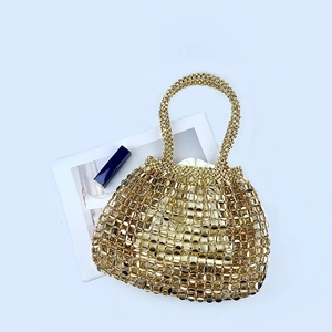 Chic gold metal woven handbag with hollow mesh pattern and beige drawstring lining
