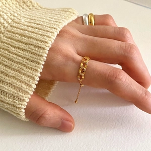 Adjustable golden chain ring for women with minimalist link design on a hand