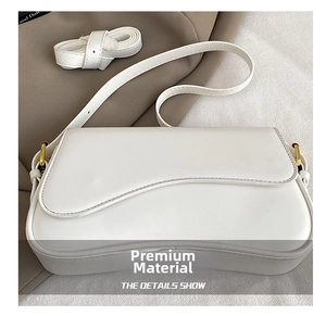 Detail showing high-quality white PU leather texture and gold metal buckle of the square bag