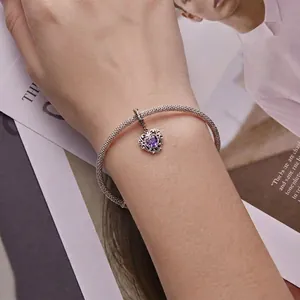 Silver snake chain bracelet with hollow heart pendant and purple heart-shaped stone