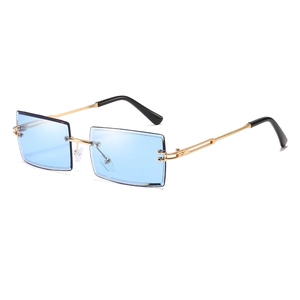 Frameless rectangular sunglasses with light blue lenses and gold metal temples shown at 45 degrees
