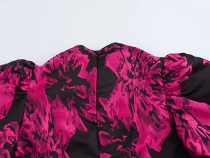Macro shot of invisible zipper and floral jacquard texture on back of dress neckline