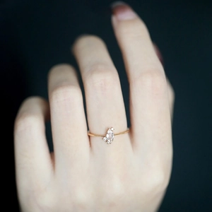 Elegant 925 sterling silver marquise cut diamond ring on finger in gold finish