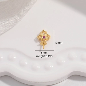 Macro shot of 10x6mm gold S925 silver pendant setting with a red gemstone inlay