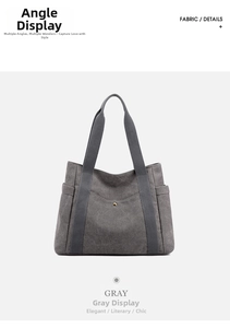 Detail view of gray canvas tote bag featuring front pocket with gold metal buckle