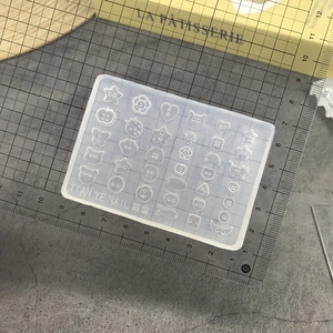 Silicone nail art mold with star, heart and flower button shapes for DIY crafts