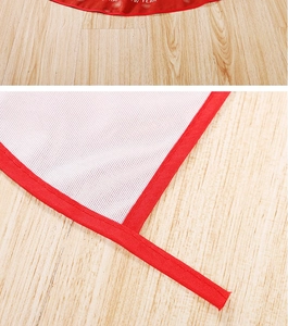 Detail of red festive edging and white polyester mesh backing with Happy New Year print