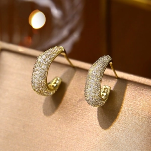 Elegant gold plated C-shaped hoop earrings with sparkling cubic zirconia crystals