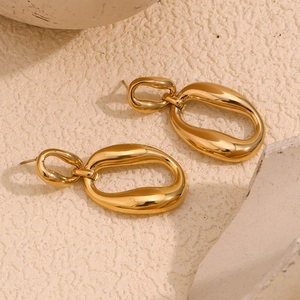 Detail of 18K gold-plated stainless steel hoop earrings with nested oval geometric design