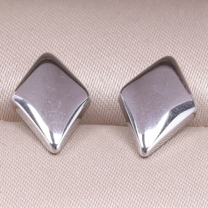 Close-up of geometric diamond-shaped 304 stainless steel stud earrings in polished silver