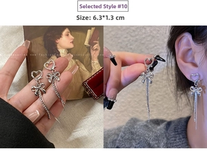 Detail shot of long tassel earrings with heart and bow motifs, size 6.3x1.3CM