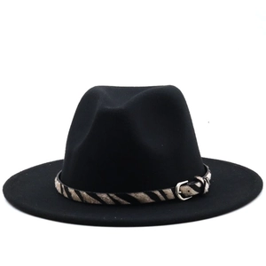 Detail of black wool fedora featuring a zebra print leather band and silver metal buckle