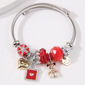 Adjustable stainless steel charm bracelet with red crystal, golden bear and heart charms