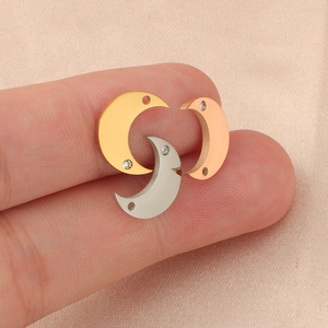 Moon-shaped titanium steel pendants with small zircons in gold, silver, and rose gold finishes