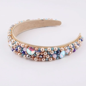 Detail of baroque headband with hand-sewn champagne pearls and blue crystals