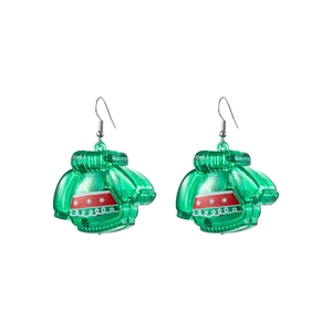 Detail of green LED Christmas sweater earrings with red patterns on white background