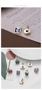 Detail of square zircon earrings in multiple colors with elegant gold plated metal frame