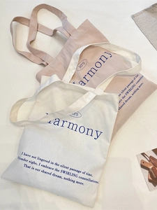 Minimalist canvas tote bags with Harmony letter print in cream and beige colors