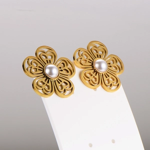 Elegant gold flower earrings with pearls on white display card for jewelry set
