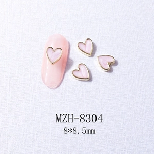 Pink heart nail art charm with gold metal edge and marble texture, size 8x8.5mm