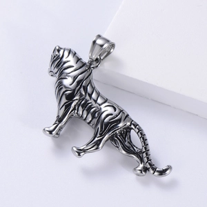 Wild tiger pendant in polished stainless steel with detailed etched stripes on a white base
