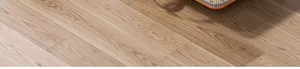 Detailed close-up of light oak wood grain texture tiles with a seamless finish