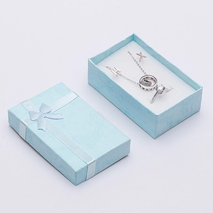 Light blue jewelry gift box set with silver necklace and crystal ring inside