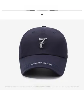Detail of navy blue baseball cap featuring silver number 7 3D embroidery and white logo