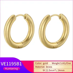 Minimalist thick round hoop earrings in polished 18K gold plated brass for women