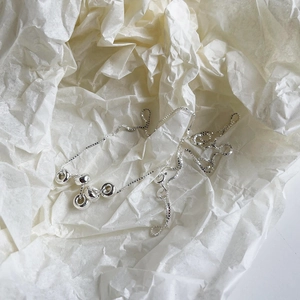 Elegant s925 silver snake chain necklace featuring circular beads on textured white paper