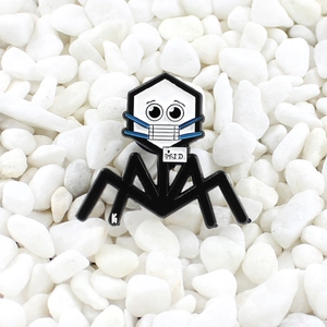 Cartoon bacteriophage enamel pin with mask on white pebble background for lab style