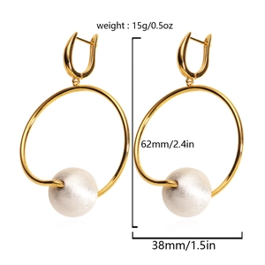 Detailed view of 18K gold hoop earrings with large white pearl dangles and 62mm height dimensions