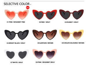 Selective color grid showing eight heart-shaped sunglasses with glitter frames and gradient lenses