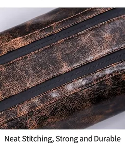 Close-up of brown PU leather bag with precise black stitching and textured grain