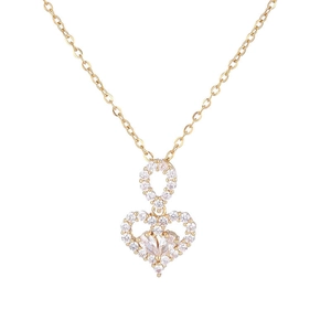 Elegant gold heart pendant necklace with shimmering crystals on a minimalist chain