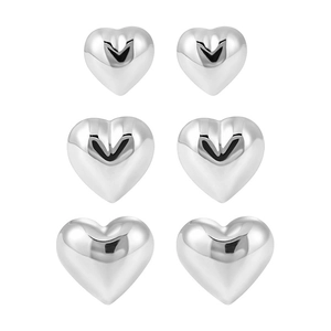 Three pairs of polished heart-shaped silver earrings in small, medium, and large sizes