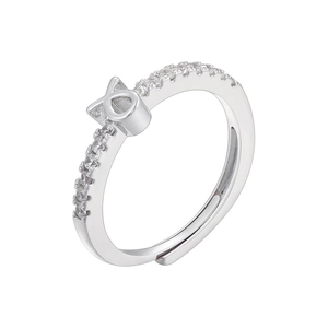 Macro shot of silver adjustable open ring with pavé-set zircons and X-shaped geometric detail
