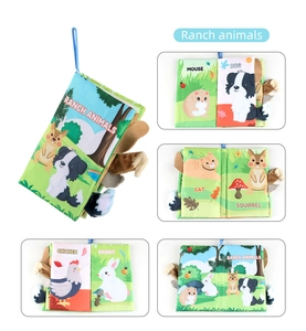 Detail of baby soft cloth book with 3D ranch animal tails and tactile textures