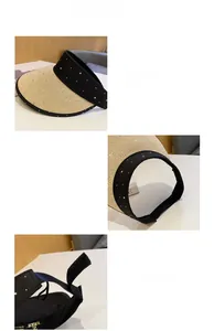 Detail showing the adjustable velcro closure and rhinestone trim on the straw sun visor