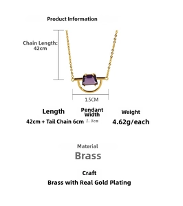 Detail view of gold-plated semicircular pendant with purple trapezoidal zircon stone