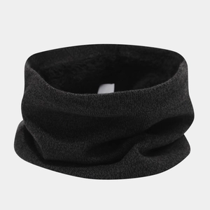 Detailed close-up of dark grey knitted neck warmer with smooth texture and laundry tag
