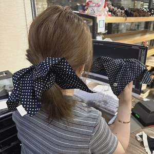 Polka dot oversized bow scrunchie for women hair styling in black and white finish