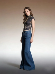 High-waisted retro flared denim jeans paired with dark printed sleeveless crop top